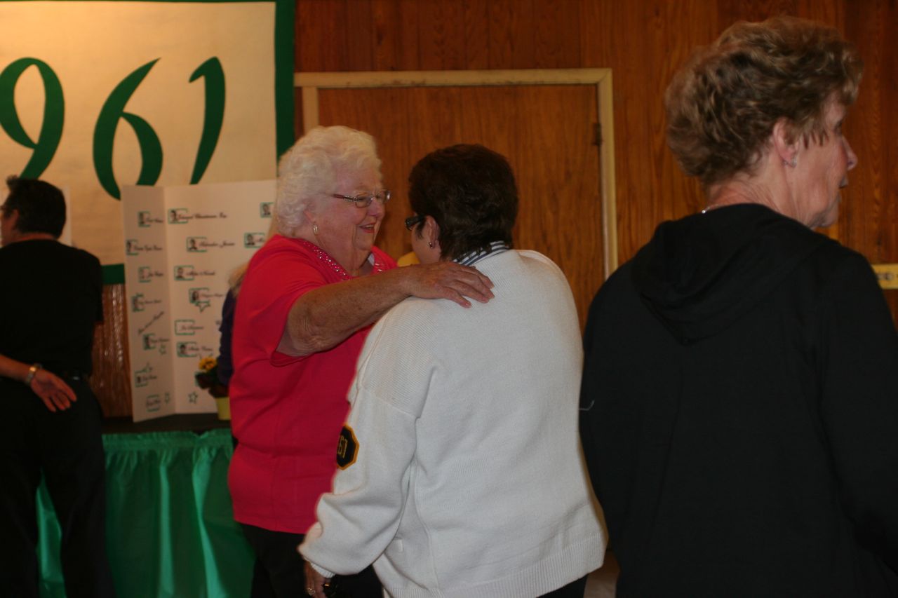 Sharon (Wilson) Carmichael greeting Caroline (Dick) Reeves